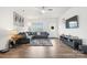 Bright living room with a comfortable sectional, a modern TV, and a front door at 1343 Kent Downs Sw Ave, Concord, NC 28027