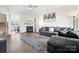 Bright living room featuring a fireplace, open floor plan, and comfortable seating at 1343 Kent Downs Sw Ave, Concord, NC 28027