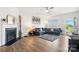 Cozy living room featuring a fireplace, stylish decor, and wood flooring at 1343 Kent Downs Sw Ave, Concord, NC 28027
