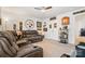 Spacious living room featuring a large sectional sofa and decorative sports memorabilia at 1343 Kent Downs Sw Ave, Concord, NC 28027