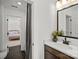 Bright bathroom with dark floor tiles, white countertops, and decorative plants at 1532 Gossage Nw Ln, Concord, NC 28027