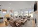 Bright living room with large windows, stylish furniture, and view to outdoor scenery at 1532 Gossage Nw Ln, Concord, NC 28027