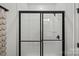 Bathroom featuring sleek glass-enclosed shower with white subway tile and black trim at 1532 Gossage Nw Ln, Concord, NC 28027