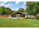 Spacious backyard view showcasing the sunroom addition, framed and ready for customization at 157 Downey Lake Rd, Dallas, NC 28034