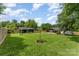 Lush backyard featuring a home with new addition and a storage shed at 157 Downey Lake Rd, Dallas, NC 28034