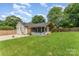 Expansive backyard featuring a white home with a newly framed, unfinished sunroom at 157 Downey Lake Rd, Dallas, NC 28034