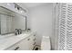 Updated bathroom with modern vanity, marble countertop, and decorative shower curtain at 157 Downey Lake Rd, Dallas, NC 28034