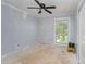 Neutral bedroom ready for customization with a ceiling fan, window and unfinished floors at 157 Downey Lake Rd, Dallas, NC 28034