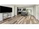 Modern kitchen with sleek cabinets, an island bar, and sliding glass doors at 157 Downey Lake Rd, Dallas, NC 28034