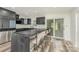 Contemporary kitchen featuring a concrete bar top, stylish barstools, and modern lighting at 157 Downey Lake Rd, Dallas, NC 28034