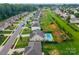 Residential street with homes featuring well-maintained yards and private pools in back at 163 Sassafras Rd, Mooresville, NC 28115