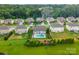 Aerial view of homes featuring a fenced in pool and large grassy areas at 163 Sassafras Rd, Mooresville, NC 28115