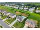 Suburban neighborhood featuring homes with manicured lawns and a community of private pools at 163 Sassafras Rd, Mooresville, NC 28115