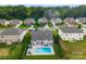 Backyard featuring a private in-ground pool, patio area, and mature landscaping at 163 Sassafras Rd, Mooresville, NC 28115