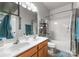 Bathroom with double sinks, shower/tub combo, and tile flooring at 163 Sassafras Rd, Mooresville, NC 28115