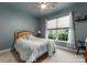 Comfortable bedroom featuring carpet, large window and ceiling fan at 163 Sassafras Rd, Mooresville, NC 28115
