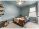 Cozy bedroom with carpet, ceiling fan and window offering natural light at 163 Sassafras Rd, Mooresville, NC 28115