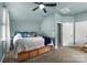 Carpeted bedroom featuring a ceiling fan, closet and natural light at 163 Sassafras Rd, Mooresville, NC 28115