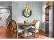 Charming dining room featuring a round table with upholstered chairs and a decorative light fixture at 163 Sassafras Rd, Mooresville, NC 28115