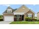 Charming brick home with manicured lawn and inviting front porch, offering curb appeal at 163 Sassafras Rd, Mooresville, NC 28115