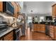 Spacious kitchen with stainless steel appliances, wood cabinets, and open layout at 163 Sassafras Rd, Mooresville, NC 28115