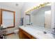 Well-lit bathroom featuring a double sink vanity, soaking tub, and charming wallpaper design at 1636 Springwinds Dr, Rock Hill, SC 29730