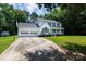 Classic two-story home with an attached two-car garage and driveway at 1636 Springwinds Dr, Rock Hill, SC 29730
