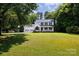 Traditional two-story home boasts a two-car garage and spacious front lawn at 1636 Springwinds Dr, Rock Hill, SC 29730