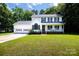 Charming two-story home featuring a two-car garage and a welcoming front porch at 1636 Springwinds Dr, Rock Hill, SC 29730