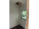 Unfinished bathroom featuring a window, exposed pipes, and walls ready for renovation at 177 Mountain View Ln, Troy, NC 27371