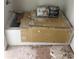 Unfinished bathroom area showing a white tub surrounded by construction debris at 177 Mountain View Ln, Troy, NC 27371