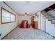 Spacious bedroom with natural light, a fireplace, and stairs leading to another level at 177 Mountain View Ln, Troy, NC 27371
