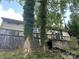 Exterior view with a deck, siding, and trees creating a wooded and natural backdrop at 177 Mountain View Ln, Troy, NC 27371