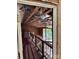 Hallway displaying exposed ceiling and wood paneling awaiting renovation at 177 Mountain View Ln, Troy, NC 27371