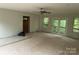 Bright living room with exterior access to deck area at 177 Mountain View Ln, Troy, NC 27371