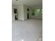 Unfinished living room featuring neutral paint, bare floors, and windows showcasing outdoor views at 177 Mountain View Ln, Troy, NC 27371