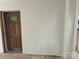 Neutral interior featuring a wooden door with a stained-glass window detail at 177 Mountain View Ln, Troy, NC 27371