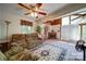 Cozy living room with a comfortable sofa, a fireplace, and a spiral staircase, offering a relaxing and inviting atmosphere at 177 Mountain View Ln, Troy, NC 27371