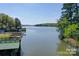 Scenic waterfront view with boat docks and a glimpse of the serene lake at 177 Mountain View Ln, Troy, NC 27371