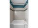 Close up on the bathtub and shower with white tile surround at 2000 Townsend Ave, Charlotte, NC 28205