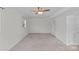 Finished basement bedroom featuring gray carpet and white paneled walls at 2000 Townsend Ave, Charlotte, NC 28205