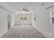 Finished basement bedroom featuring gray carpet and white paneled walls at 2000 Townsend Ave, Charlotte, NC 28205