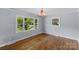 Hardwood dining room featuring large windows, offering a bright and airy space at 2000 Townsend Ave, Charlotte, NC 28205