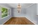 Bright dining room with hardwood floors, neutral paint, and large windows offering scenic outdoor views at 2000 Townsend Ave, Charlotte, NC 28205