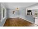 Open dining room with hardwood floors, natural light, and view to kitchen, perfect for Gathering meals at 2000 Townsend Ave, Charlotte, NC 28205