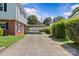 Long driveway leads to a carport, providing ample parking and access to the backyard at 2000 Townsend Ave, Charlotte, NC 28205