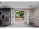 An open view of the kitchen leading out to a deck through a set of french doors at 2000 Townsend Ave, Charlotte, NC 28205