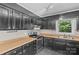 A partial view of the kitchen featuring black cabinets and stainless steel appliances at 2000 Townsend Ave, Charlotte, NC 28205