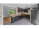 Functional kitchen featuring dark cabinetry, tiled floors, and a convenient layout for cooking and entertaining at 2000 Townsend Ave, Charlotte, NC 28205
