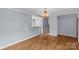 Cozy room with hardwood floors and neutral paint, showcasing an open layout and staircase at 2000 Townsend Ave, Charlotte, NC 28205